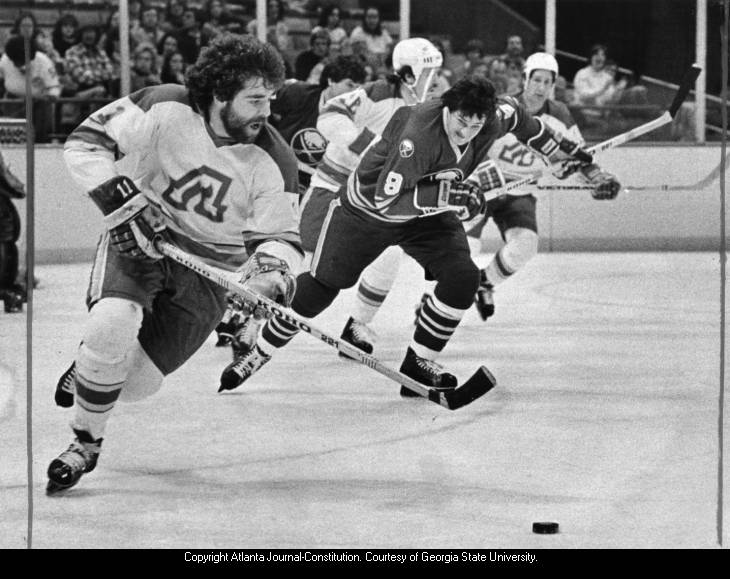 Atlanta Flames' Bob MacMillan with Jacques Richard chasing him, 1979.