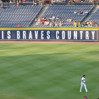 Photograph of Atlanta Braves stadium with text "This is Braves Country" on the wall