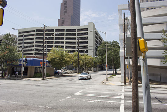 These sections of Courtland Street are currently five lanes wide with no on-street parking and are surrounded by substantial parking facilities. Photos by author.