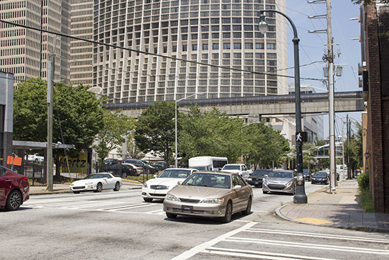 These sections of Courtland Street are currently five lanes wide with no on-street parking and are surrounded by substantial parking facilities. Photos by author.